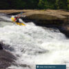 A kayaker rides down the rapids at Valley Falls State Park.