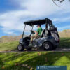 A man in a golf cart at Stonewall Resort State Park