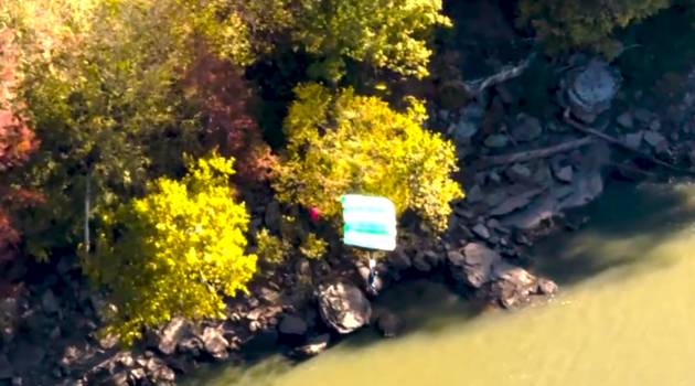 A person parachutes off of the New River Gorge Bridge during Bridge Day