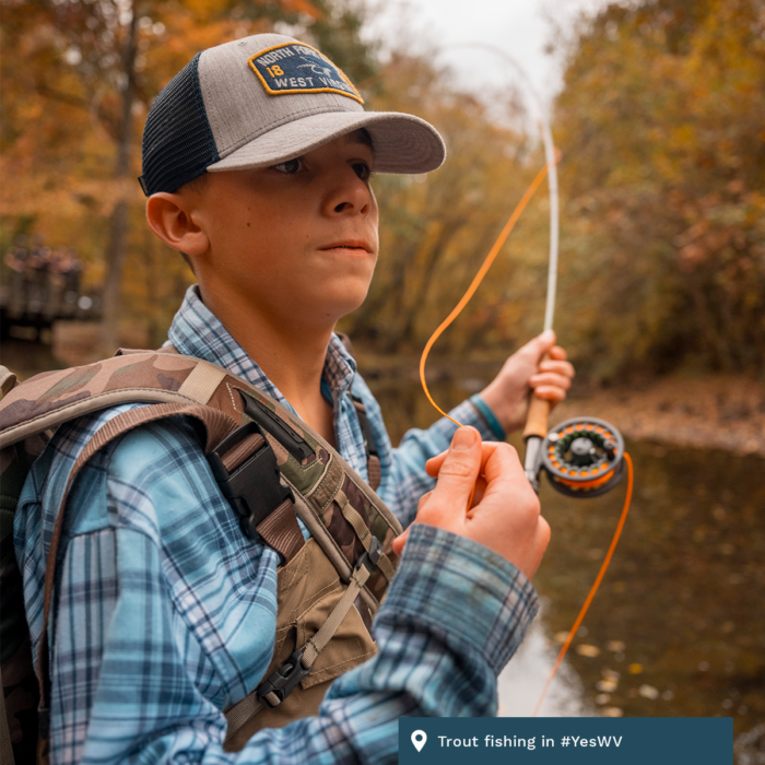 A young man trout fishes in West Virginia